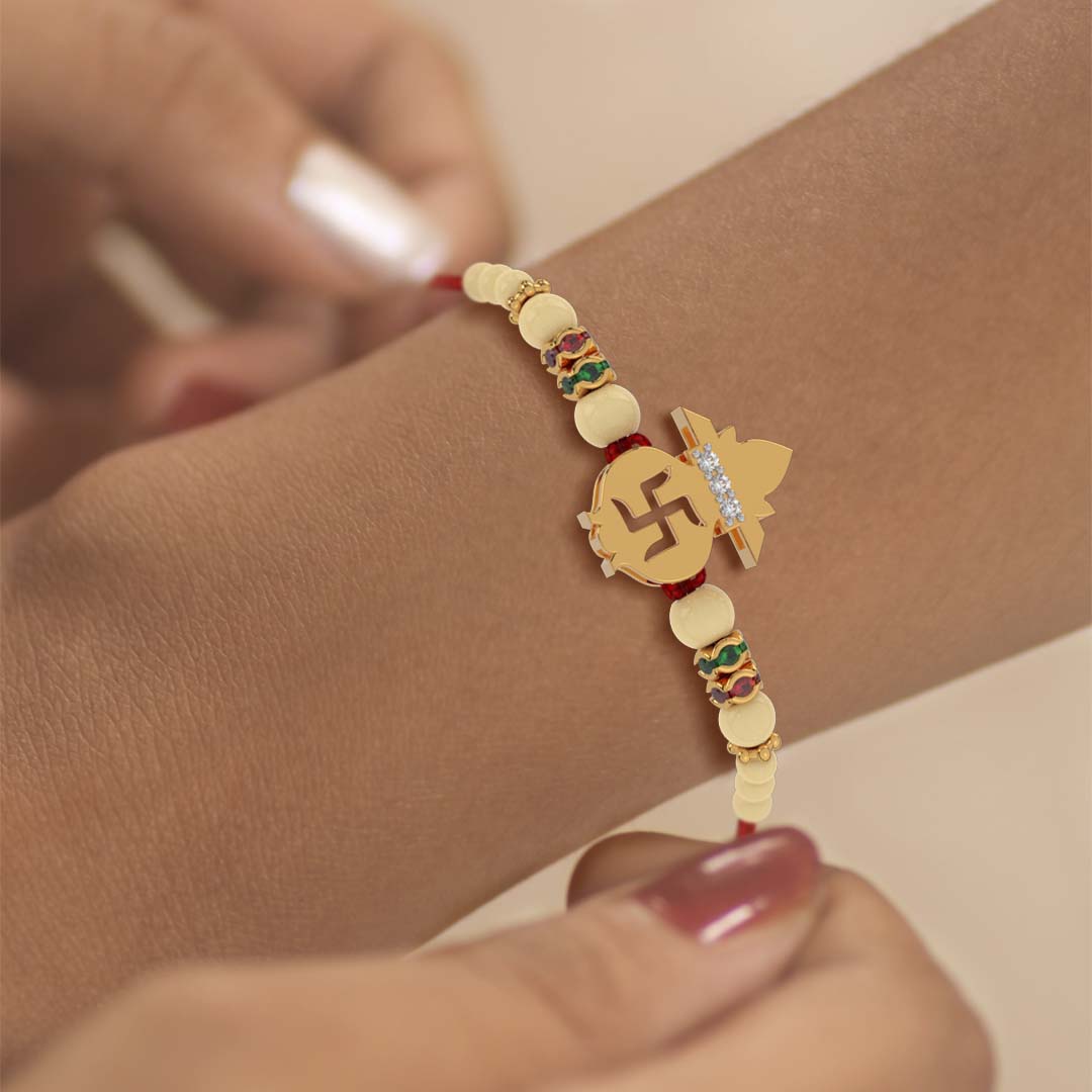 Swastik Kalash Yellow Gold Rakhi